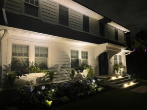 front of house at night time with lighting
