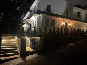 Side of house at night time with lighting