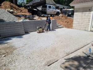 Hardscaping - Compacting gravel for patio
