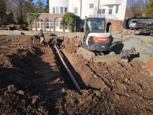 Excavation - Laying pipe in trench